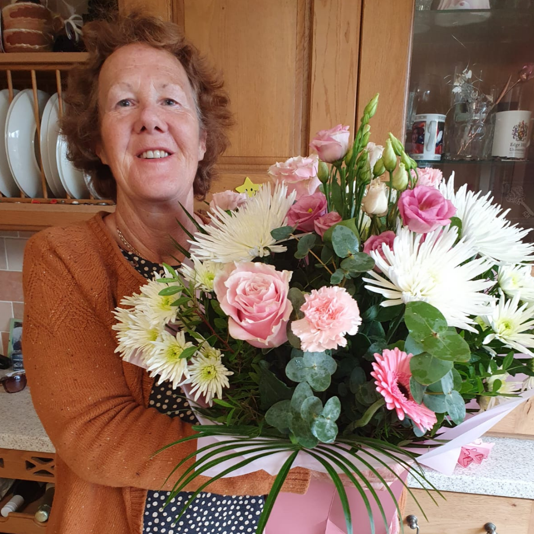 WINK Rayleigh Committee member Perrie with a bunch of flowers